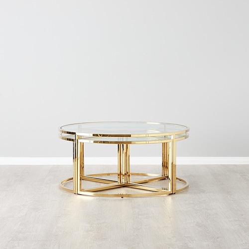 Round coffee table with glass top and polished gold stainless steel base with four movable mini trangular tables underneath.